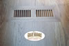 Matching hardwood flush-mount floor vent built into a hardwood floor