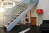 Modern stairway with hardwood stair treads and landing